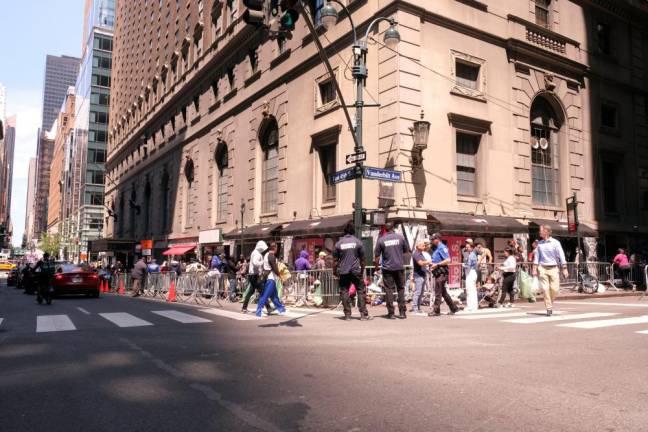 Asylum-seekers queuing up near the Roosevelt Hotel in Midtown Manhattan in July 2023 which was converted into an emergency shelter and processing center. On Dec. 10, Mayor Eric Adams announced that six migrant shelters in Manhattan would be closing in the next two months, but the Roosevelt Hotel is not one of them.