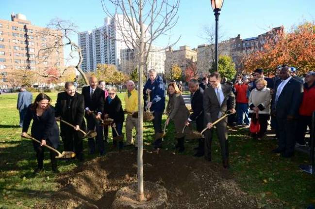 Mayor Bill de Blasio, center, and former Mayor Michael R. Bloomberg, to his right in yellow, were among city officials and others celebrating the planting of the one millionth tree of the MillionTreesNYC campaign in the Bronx&#x2019;s Joyce Kilmer Park in November. Photo: Malcolm Pinckney, Department of Recreation &amp; Parks.