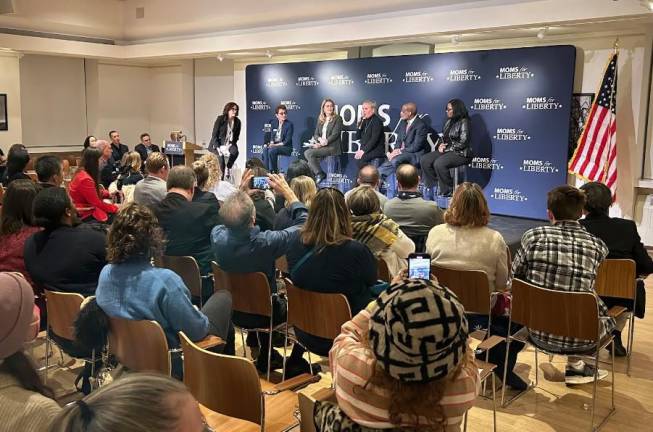 Maud Maron, a member of the Community Education Council in Manhattan’s District 2, was reinstated to her post by a federal judge on Sept. 3 after city officials previously removed her for allegedly violating city regulations governing the conduct of parent leaders. Here, Maron sits on stage at an event hosted by the right-wing group Moms for Liberty.