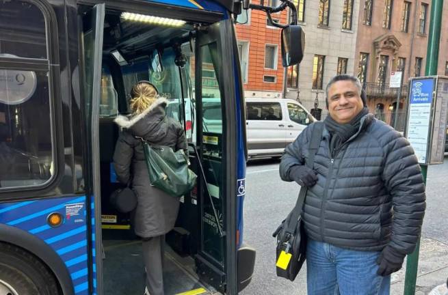 Tom Florey waits to board an M50 bus in Midtown, Feb. 20, 2025.