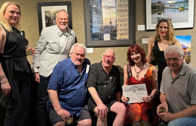 <b>Designer Andrea Thurlow, Jeff Reid, Shawn Curran, George Sanders, Karen Rempel (wearing Andrea T New York), Amy Mohler, and Keith Kelly below Karen’s photo “Reflections.”</b><i> </i>