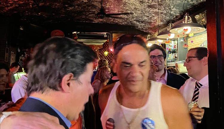 Micah Lasher, on the far right, surrounded by supporters at the watch party at E’s Bar on The Upper West Side on primary night June 25.