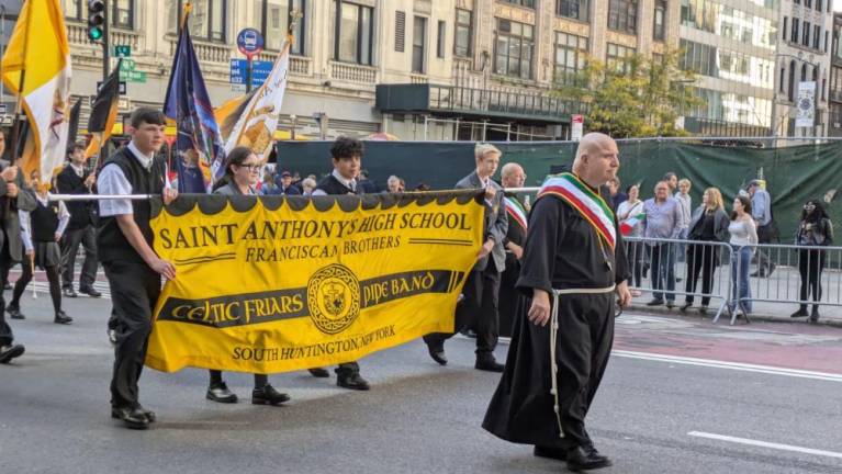 St. Anthony’s High School from Long Island is led up Fifth Ave. at the annual Columbus Day parade on Oct. 14 by Brother David, who grew up in Stuyvesant Town on the East Side.