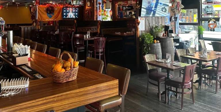 Some of the big-screen TVs that hung inside the Abbey Tavern and attracted a sports-friendly crowd for football of the American, Gaelic and European varieties.