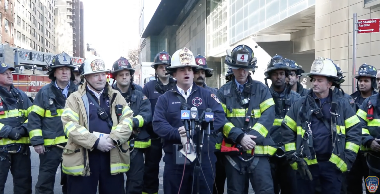 Deputy Chief Michael Trahan and Lieutenant Nick Schneider hold press conference.