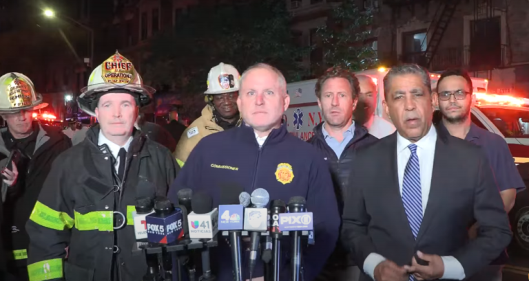 FDNY Commissioner Robert Tucker, center, spoke to the press after the fire at 528 W. 145th St. had been contained.