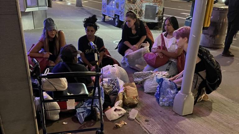 New York Society of Ethical Culture volunteers speak with a person they encountered on the street during a previous Midnight Run.