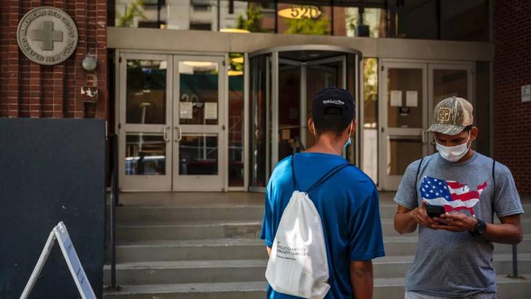 Migrants from Venezuela in 2022 outside the facility that now houses the NYC Asylum Seeker Application Help Center.