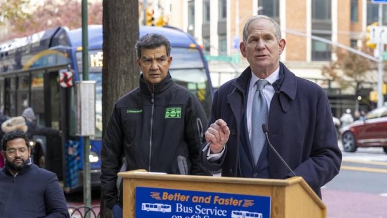 MTA Chief Janno Lieber (at podium) and NYC DOT Commissioner Ydannis Rodriguez (left, green logo) announce the completion of a bus lane overhaul project for 96th St.