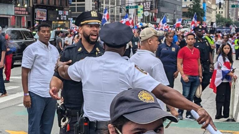 Surprised and agitated police react to security breach at approximately 1:03 p.m. at 6th Avenue and West 39th Street.