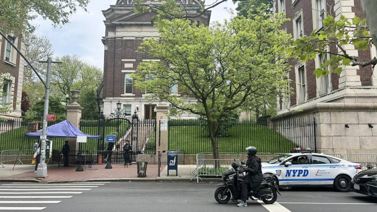 Police patrolling the area on Broadway avenue, between W 116th street and W 120th street under tents and in their cars. The only entrance accessible to Columbia students that live on campus is the one on W 116th street, all other entrances are closed off. The university’s president requested police patrol the area until at least May 17th. Photo Credit: Alessia Girardin.