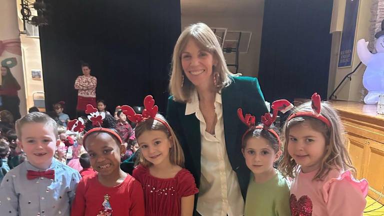 At the Christmas sing-along with Head of School Mary Larkin.